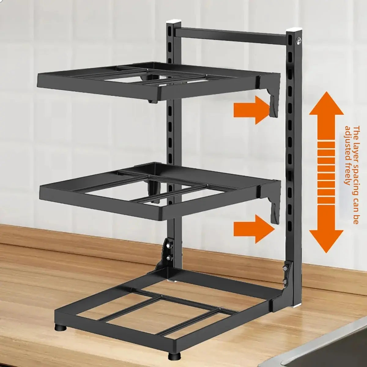 Black adjustable shelf system on a wooden floor with white wall background