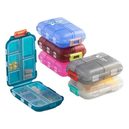 Set of colorful pill organizers stacked on a white background