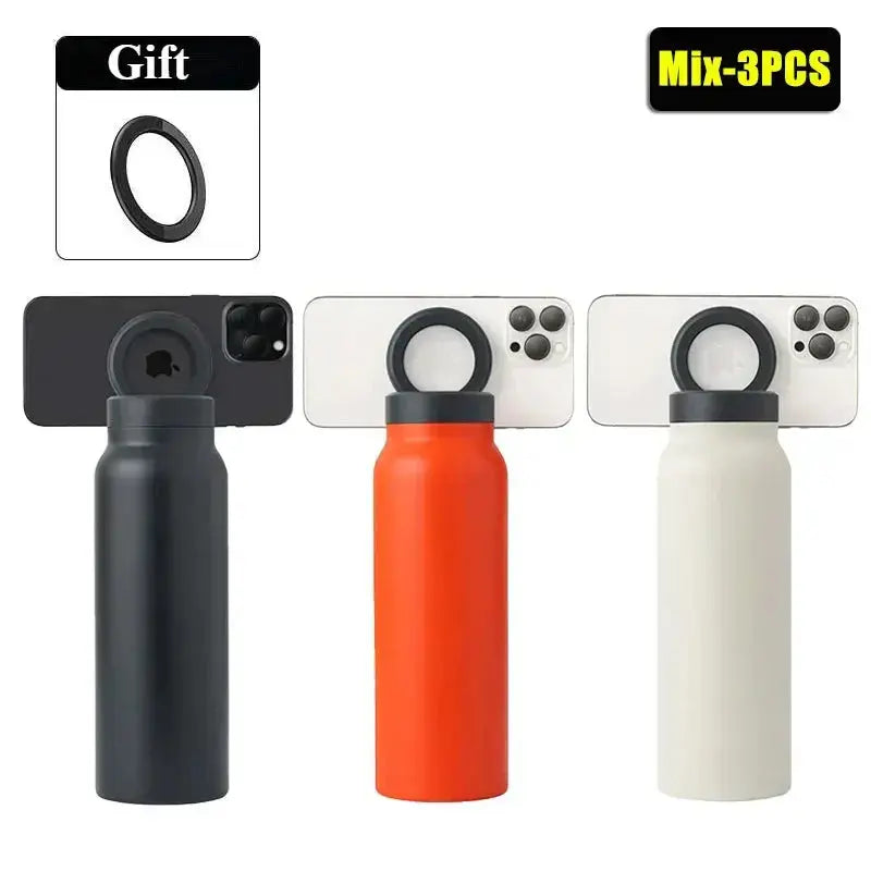 Three metal bottles with camera lens protectors on a white background