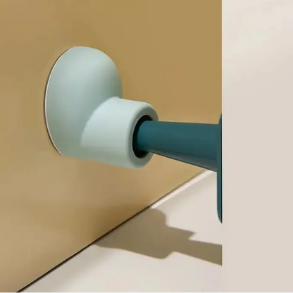 Close-up of a door handle on a wooden door with a neutral background